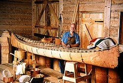 Peterborough Canoe Museum employee building a birchbark canoe