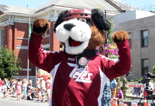 Peteroborough Petes mascot, Roger, a smiling dog wearing a hockey helmet and Petes jersey