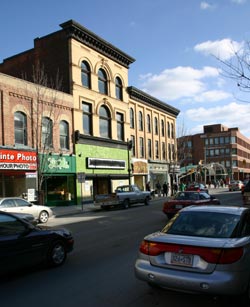 View of George Street in downtown Peterborough showing parked and driving cars